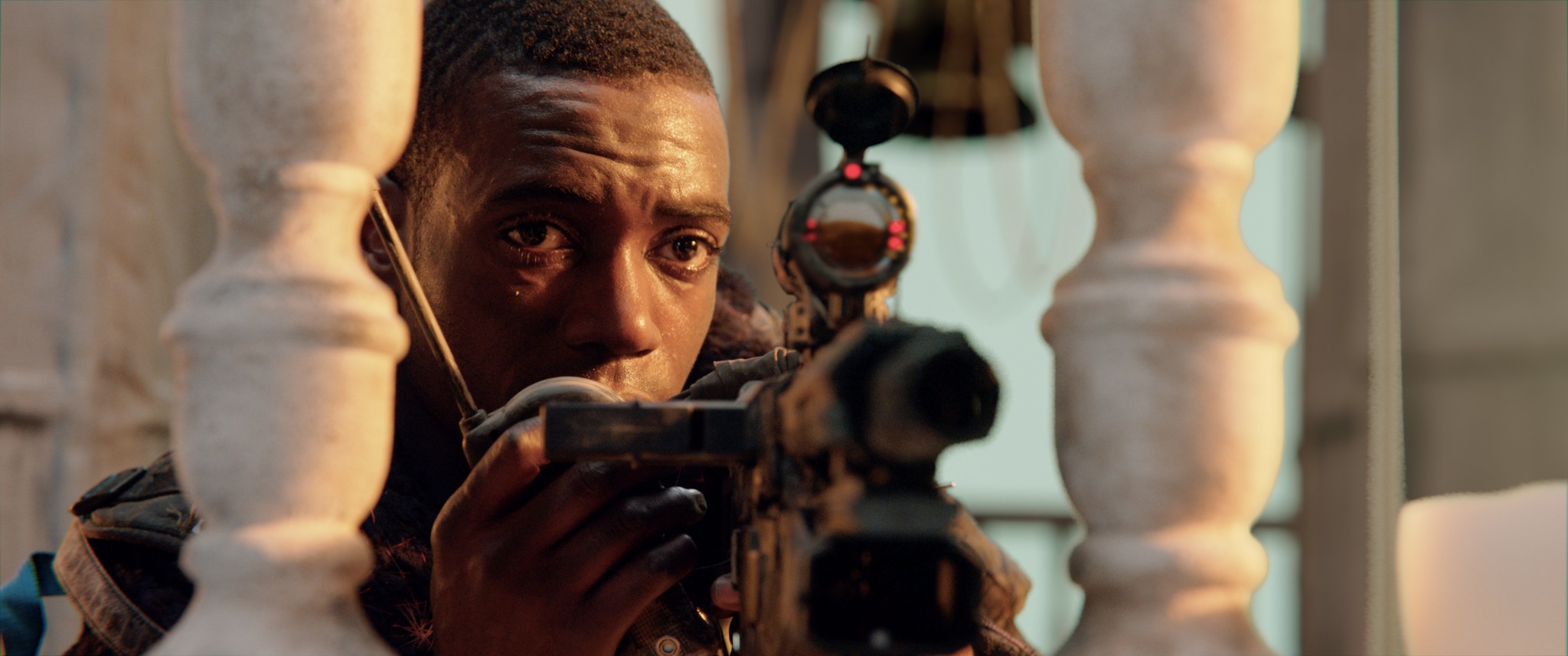 A still from Tears of Steel: Barley holds a radio to his mouth beside a rifle scope.